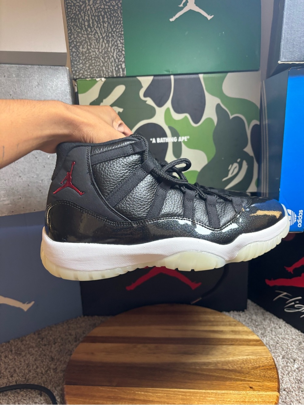 Jordan 11 72-10 Sneakers in Black and Red